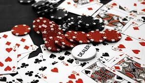 Live Sic Bo dealer with dice cup and betting table layout